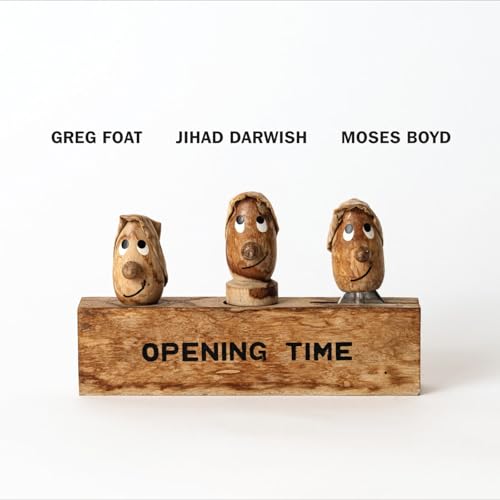 Album cover featuring three wooden figures on a wooden base with text.