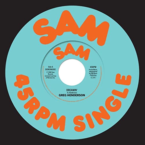 Turquoise 7-inch vinyl record label with orange text, centered hole.
