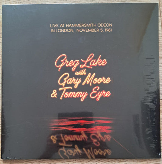 Black vinyl record cover featuring Greg Lake, Gary Moore, and Tommy Eyre.