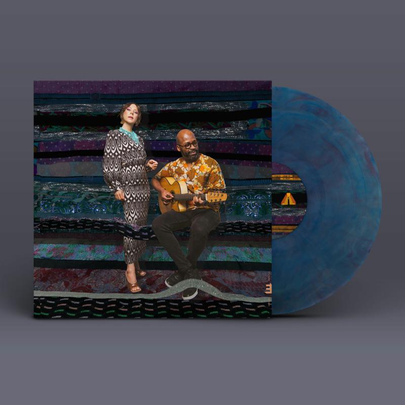 Album cover for Gretchen Parlato's "Lean In" featuring two musicians and vinyl record.