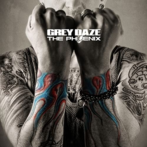 CD cover: man with tattoos, fists raised, album title "The Phoenix".