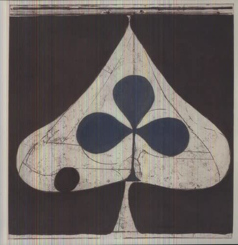 Abstract spade shape with a dark blue trefoil inside against a black background.