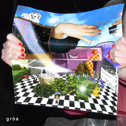 Hands holding a surreal collage print with a checkered floor, plants, and floating elements.