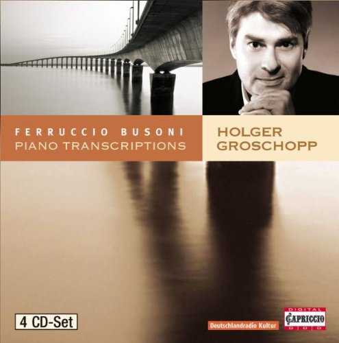 CD cover with a man's portrait and a pier over water.