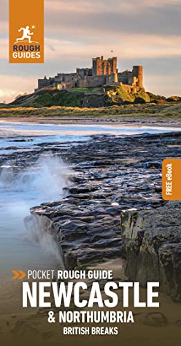 Rough Guides travel book cover featuring Bamburgh Castle overlooking a rocky coastline at sunset.