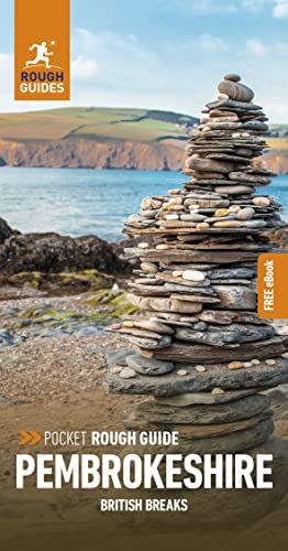 Pembrokeshire travel guide cover with stacked stones and coastal landscape.