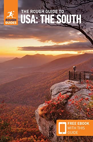 Travel guide cover featuring a scenic mountain landscape at sunset.
