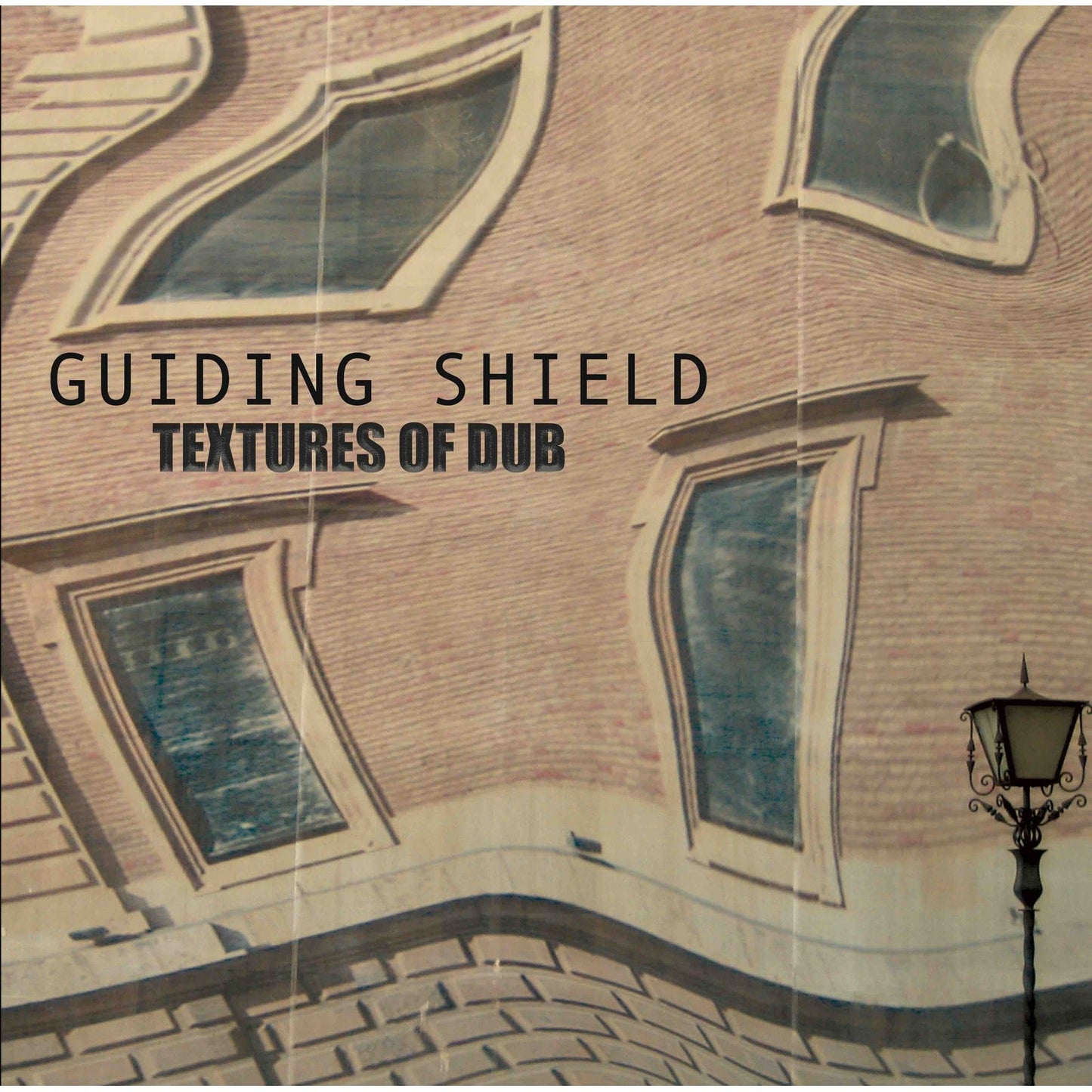 Vinyl record cover with painted building facade and text "Guiding Shield".
