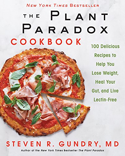 Cookbook cover featuring a pizza with prosciutto and basil.