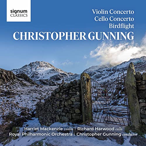 CD cover showing a snowy mountain landscape with a stone wall and metal gate.