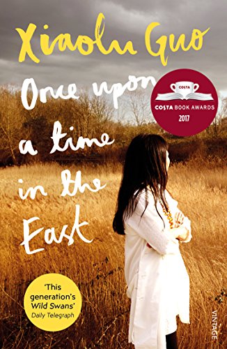 Book cover showing a woman standing in a field of tall, golden grass.