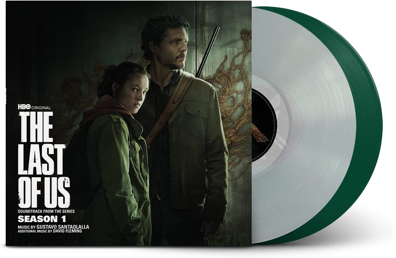 "Vinyl record with green sleeve and transparent disk, featuring 'The Last of Us' cover art."