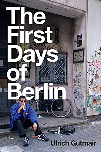 Book cover featuring a man sitting on a Berlin street with a bicycle.