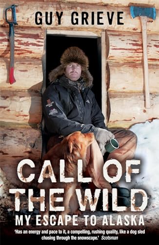 Man in fur hat with dog, standing in a rustic cabin doorway.