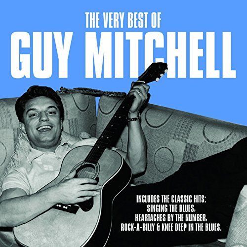 CD cover featuring Guy Mitchell with a guitar, seated on a sofa.