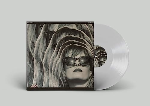 Vinyl record with album cover featuring a woman with long hair.