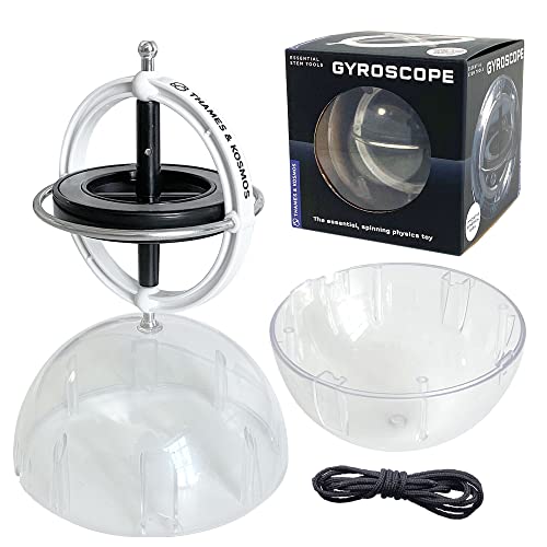 A Thames & Kosmos gyroscope with its packaging, clear plastic domes, and a black string.