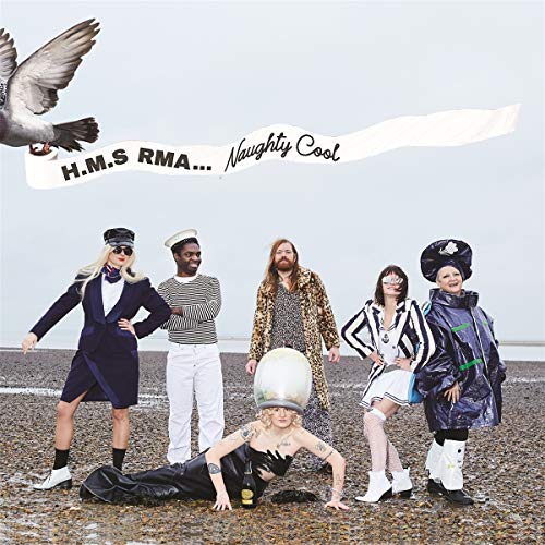 Album cover featuring a group in eclectic outfits against a pale sky.