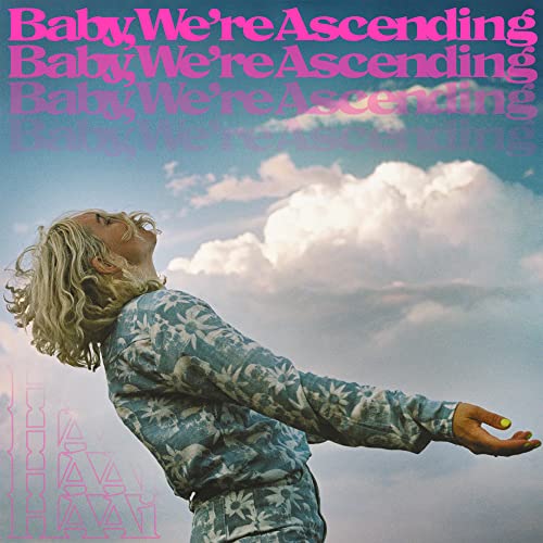 Album cover: person looking up at clouds, pink and blue tones.