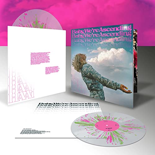 Vinyl record with colorful splatter, album cover featuring person looking up.