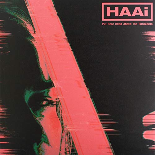 Vinyl album cover with a distorted face and red graphic elements.