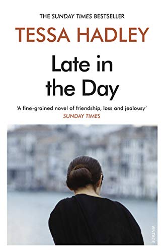Book cover: woman viewed from behind, overlooking a grey cityscape.