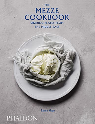 Cookbook cover with white dip, linen, and title "The Mezze Cookbook.