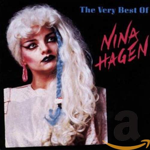 Nina Hagen with long blonde hair and a blue braid on a black background.