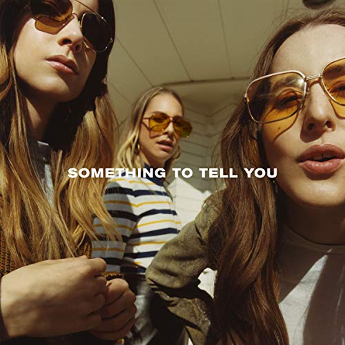 Three women wearing sunglasses, album cover for Haim’s “Something To Tell You.”