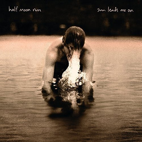 Album cover: person with head down in water, sepia tone.