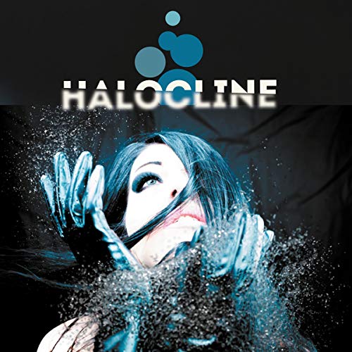 A woman with dark hair reaches up through splashing water against a black background.