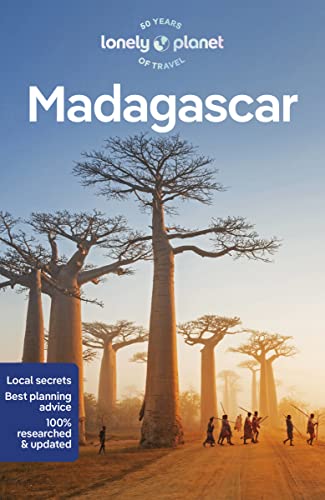 Lonely Planet Madagascar travel guide cover featuring baobab trees and people walking on dirt.