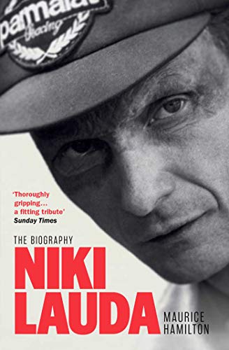 Black and white close-up portrait of Niki Lauda wearing a racing cap.
