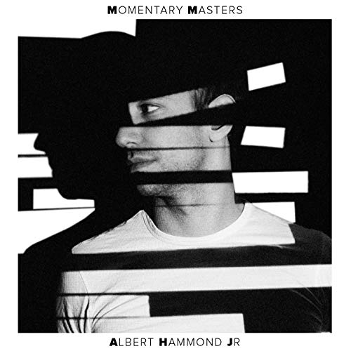Black and white album cover featuring a man’s face with geometric overlays.