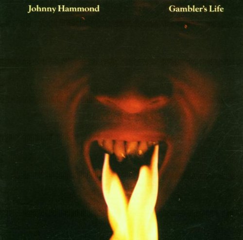 Close-up of a face with an open mouth emitting bright orange flames.