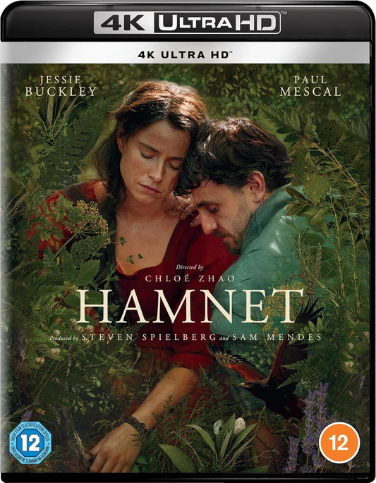 “Hamnet” Blu-ray cover: couple embracing in a field, foliage background.