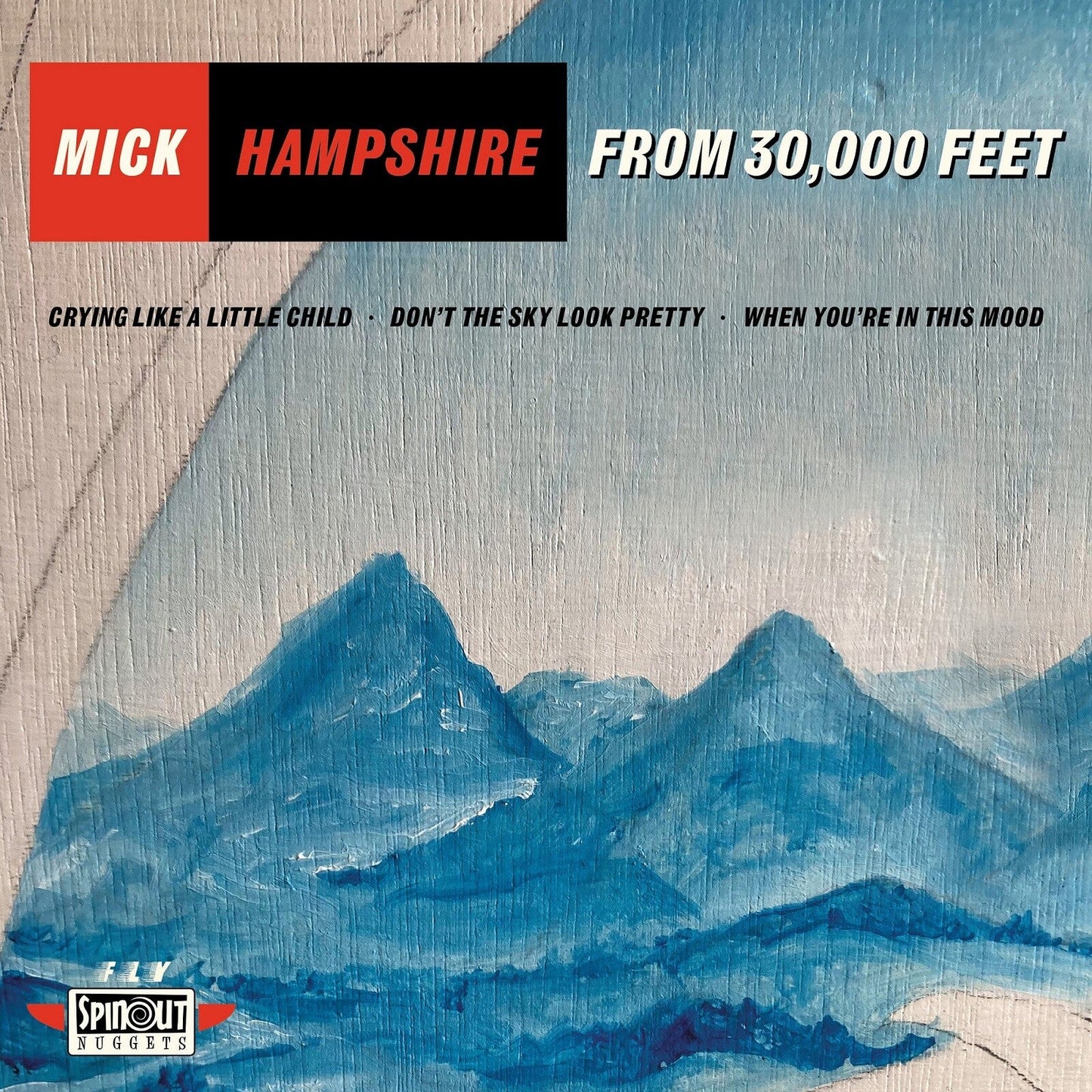 Vinyl record cover: mountains under a textured blue sky, text overlay.