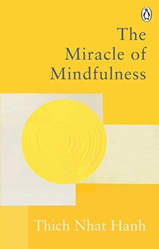Yellow book cover with circular design and text: "The Miracle of Mindfulness.