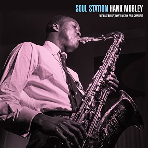 Hank Mobley playing the saxophone on the Soul Station album cover.