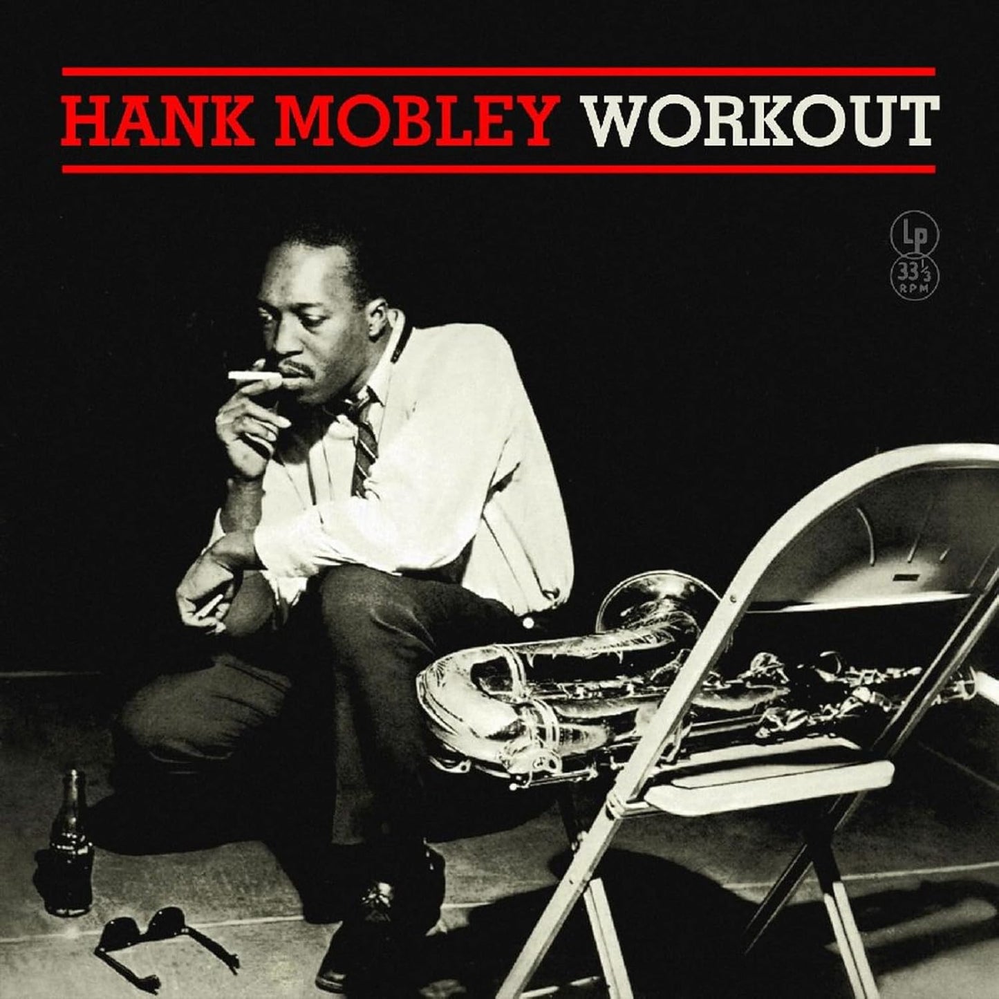 Hank Mobley’s “Workout” album cover featuring a black and white portrait with saxophone.