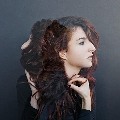 CD cover featuring a woman with long, wavy reddish-brown hair.