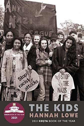 Black and white photo of a group of young people holding anti-Nazi protest signs.