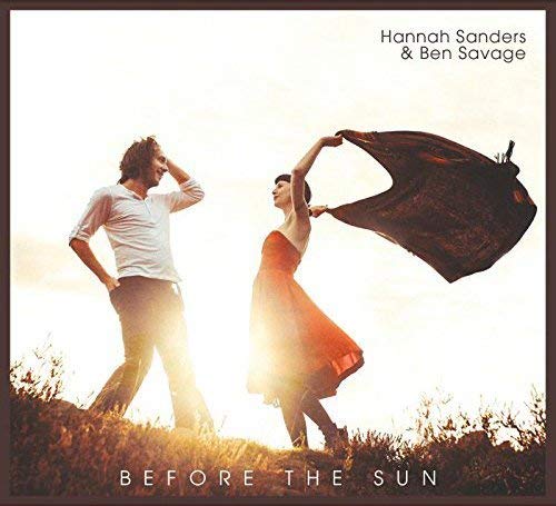 CD cover with a couple silhouetted against a bright sunset.
