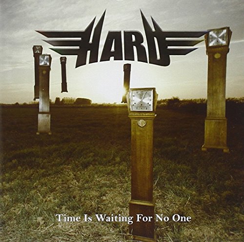 CD cover with clocks in a field under a cloudy sky.