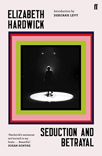 Book cover: a lone figure stands spotlighted on a dark stage.