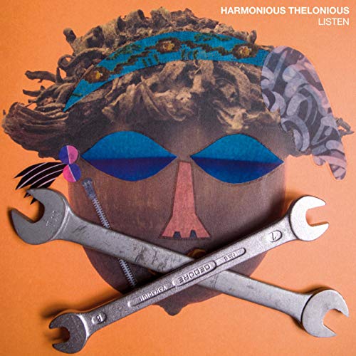 CD cover: face collage with wrenches, headband, and blue eyes.