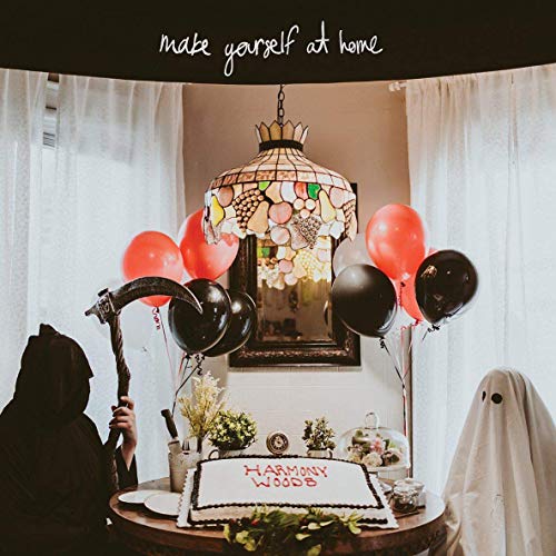 Vinyl album cover with a decorated room, balloons, and ghostly figures.