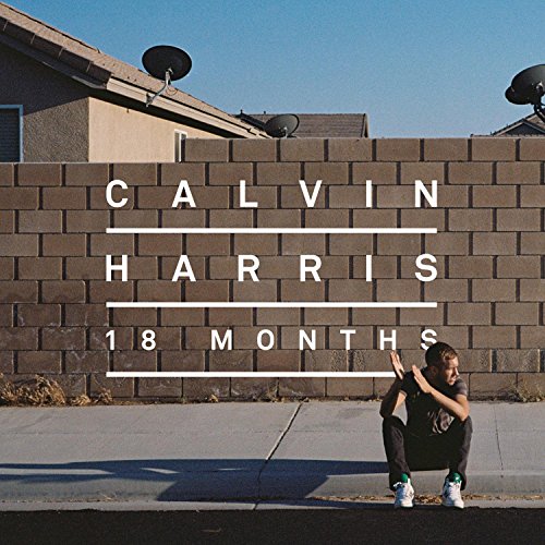 Calvin Harris sits on a curb in front of a brick wall with album text.