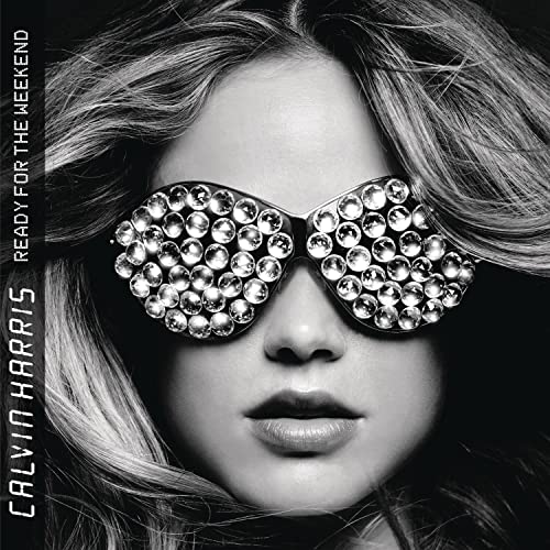 Black and white portrait of a woman wearing jeweled sunglasses.
