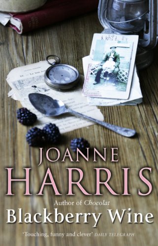 Book cover for "Blackberry Wine" by Joanne Harris with vintage objects.